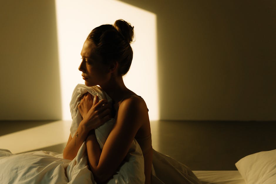Woman meditating peacefully indoors with soft light